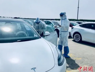 洋山海關保障特斯拉工廠復工復產后首批整船電動車出口